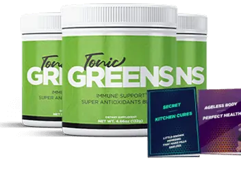 Glass of green smoothie next to a scoop of greens powder